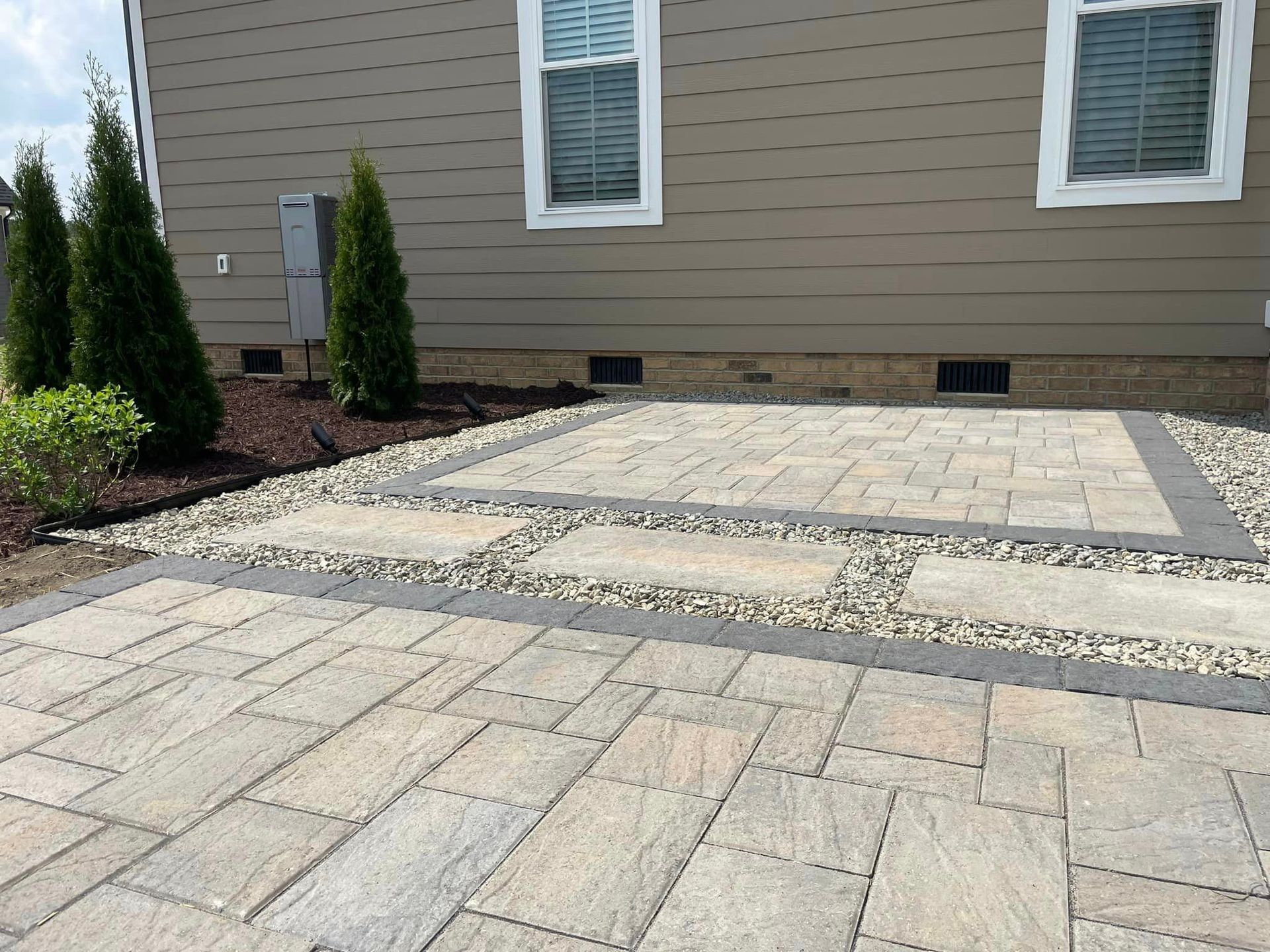 A house with a patio and trees in front of it