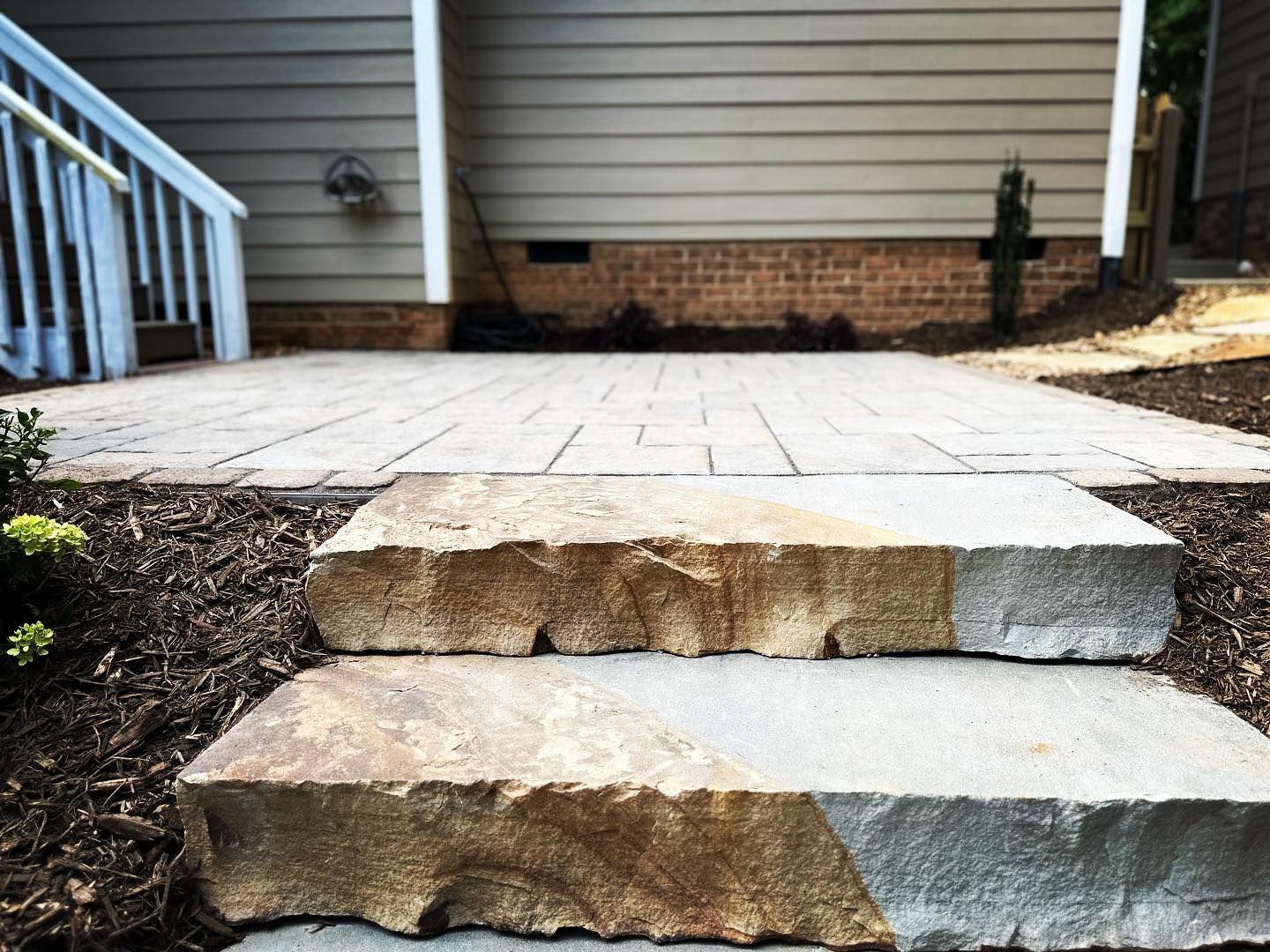 A set of stone steps leading up to a house.