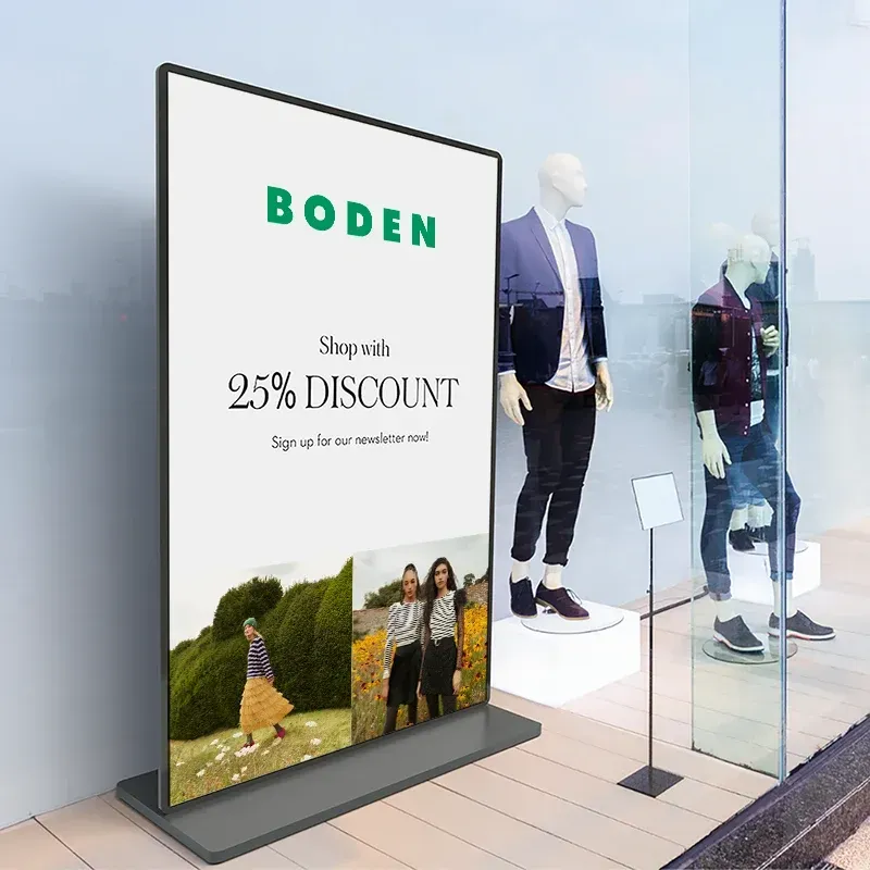 A sign in a shop window advertising a 25% discount.