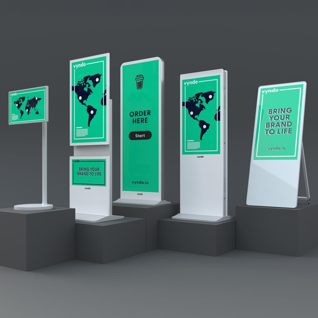 A group of signs, one of which says "Order here"