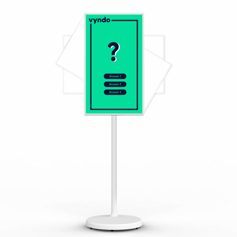 There is a green sign with a question mark on a stand.