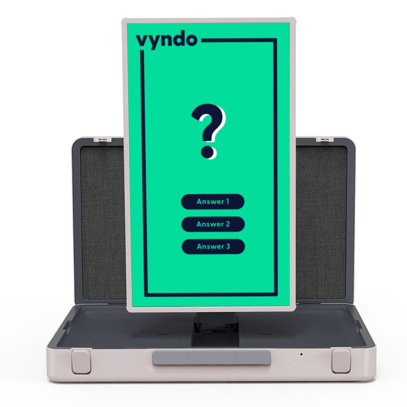 There is a computer monitor in an open briefcase.