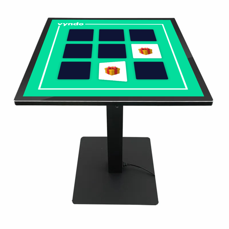 A table with a screen on it that looks like a chessboard.