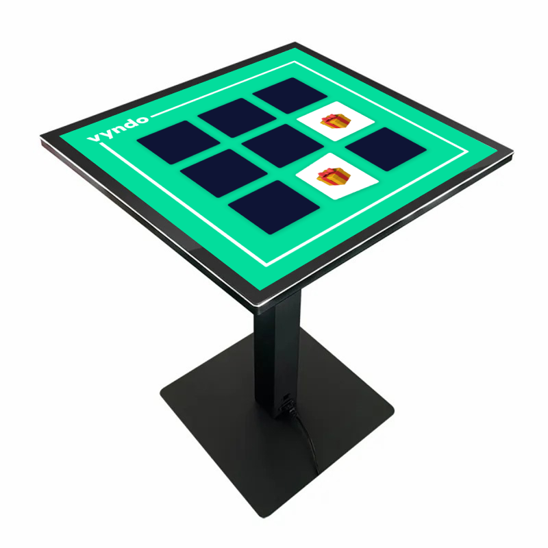 A table with a screen on it that looks like a chessboard.