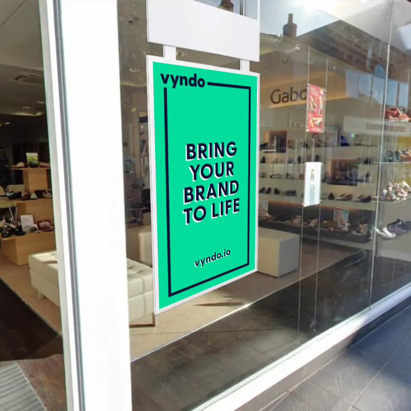 A green sign with the inscription "Bring your brand to life"