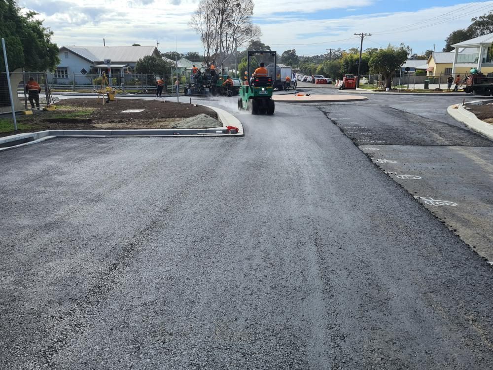 Road Construction: Asphalt Paving With a Roller Machine in Progress — Jim Anderson Earthmoving Pty Ltd In Gloucester, NSW
