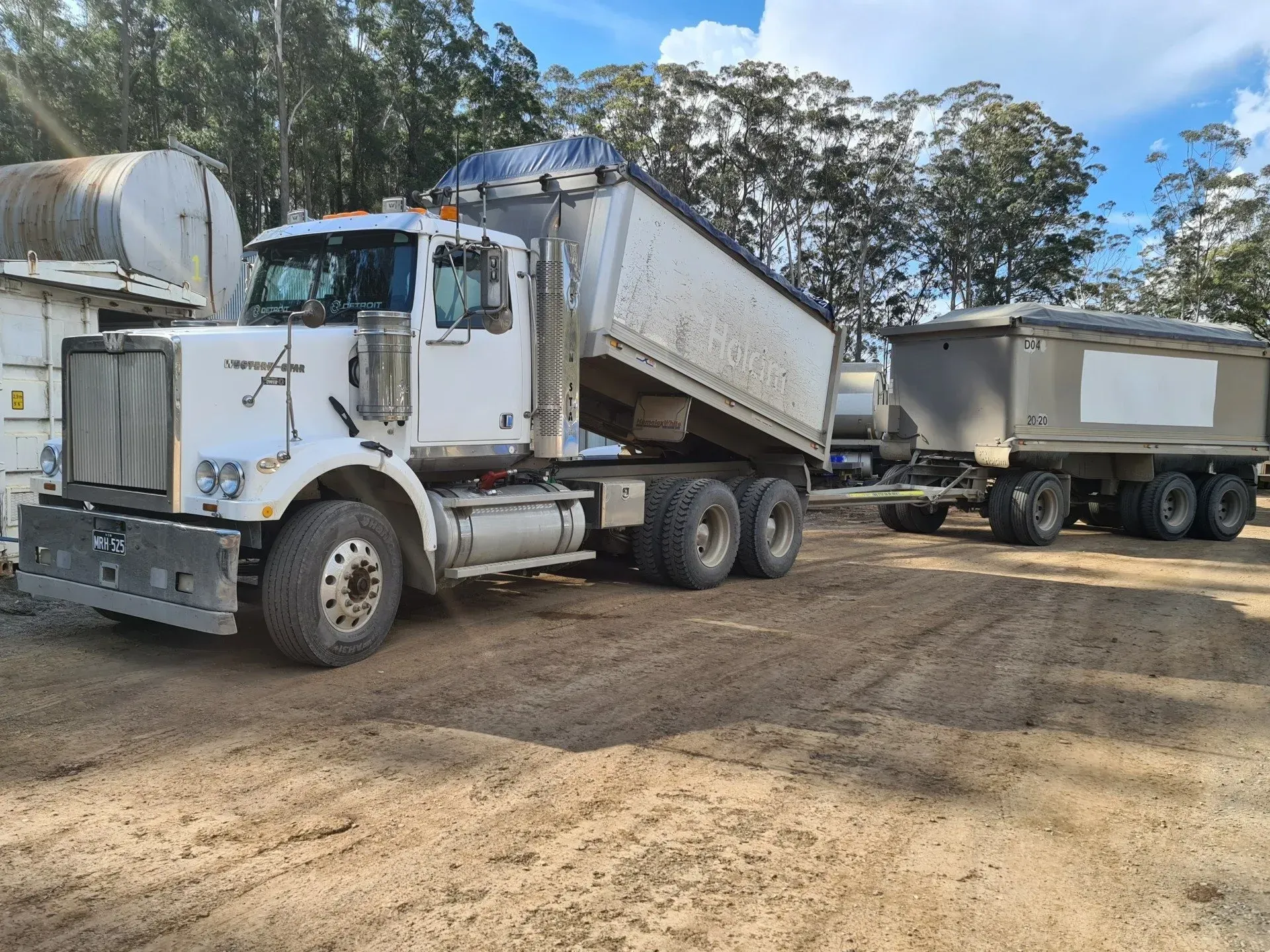 White Semi-Truck with Trailer, in A Dirt Lot — Jim Anderson Earthmoving Pty Ltd in Coopernook, NSW