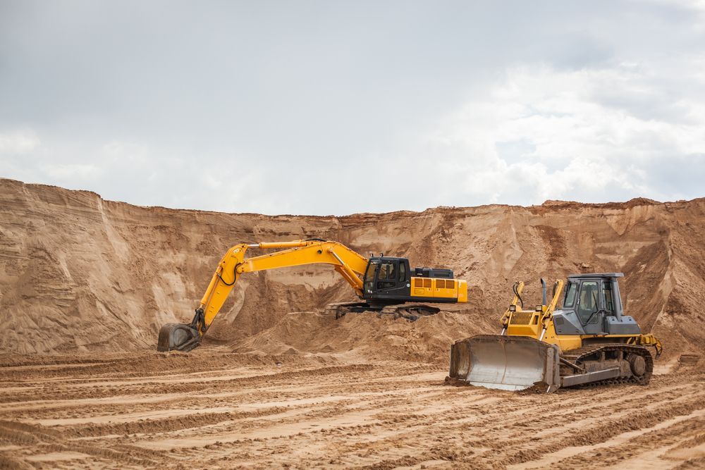 Yellow Excavator and Bulldozer Working in a Sand Quarry — Jim Anderson Earthmoving Pty Ltd In Laurieton, NSW