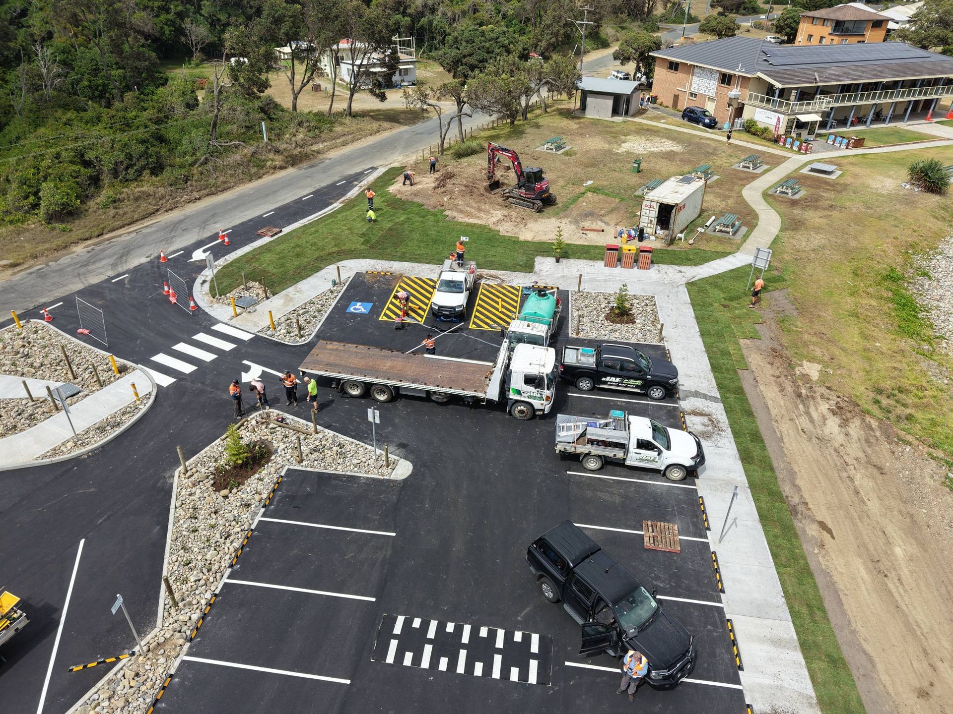Aerial view of a construction site with parked trucks and machinery — Jim Anderson Earthmoving Pty Ltd In Coopernook, NSW