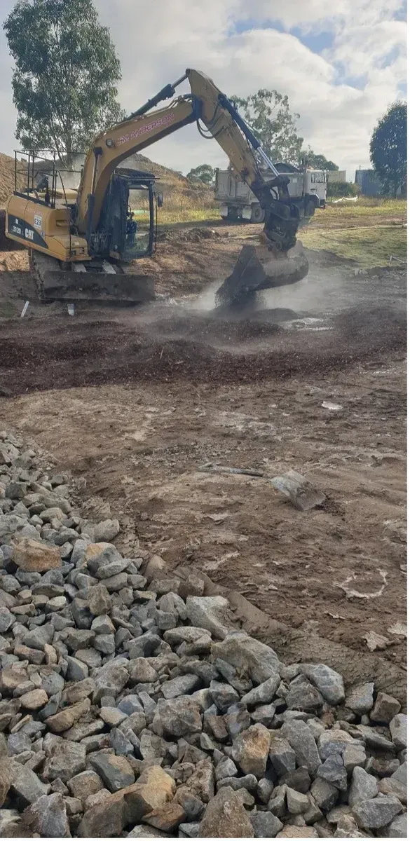 Excavator Working on A Construction Site — Jim Anderson Earthmoving Pty Ltd in Coopernook, NSW