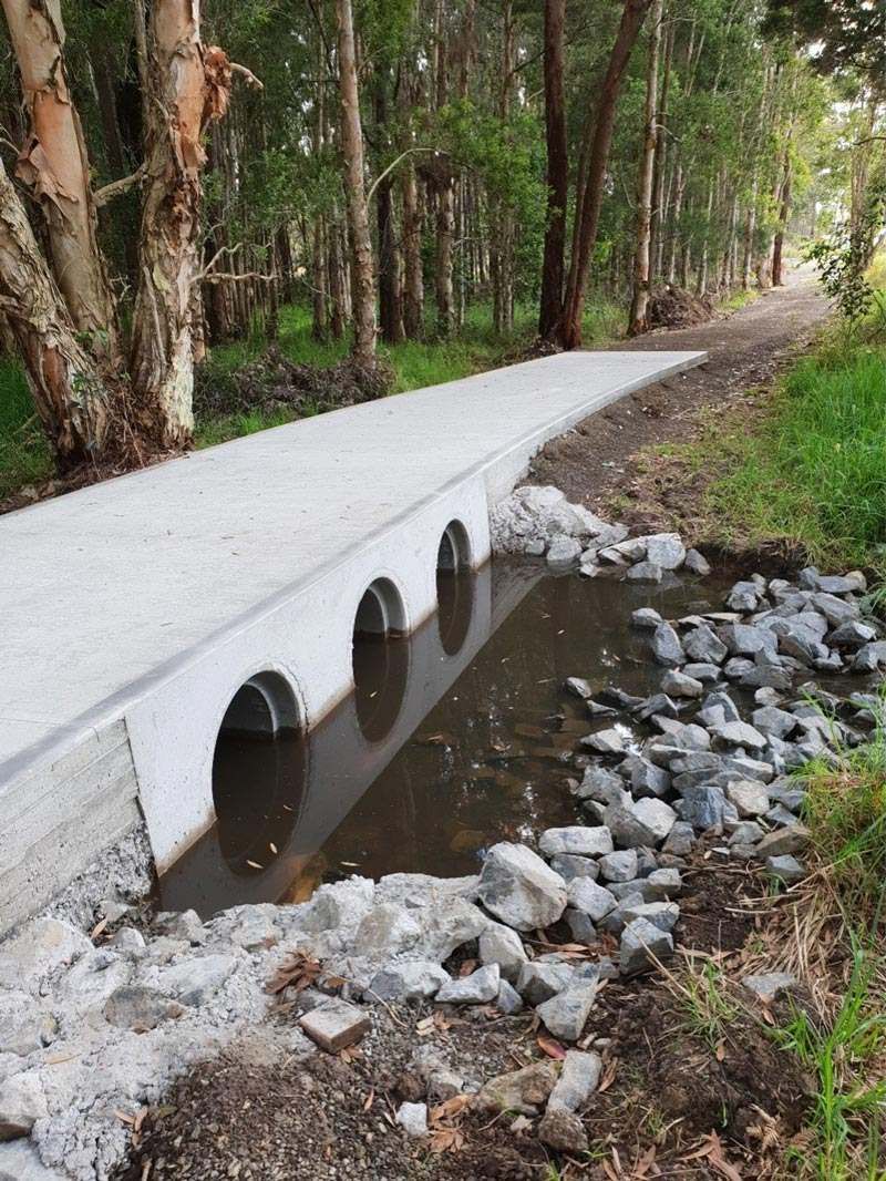 Concrete Bridge Over a Small Creek in a Forest — Jim Anderson Earthmoving Pty Ltd In Halliday's Point, NSW