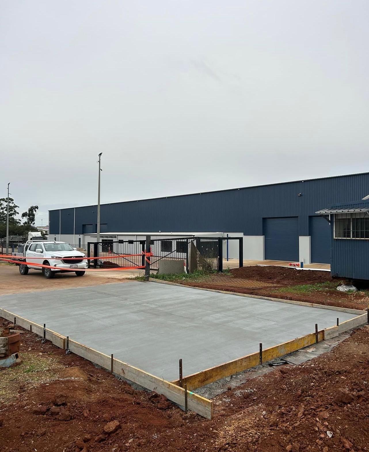 Newly Poured Concrete Pad With a Truck — Chief Structural Landscaping In Darling Downs, QLD
