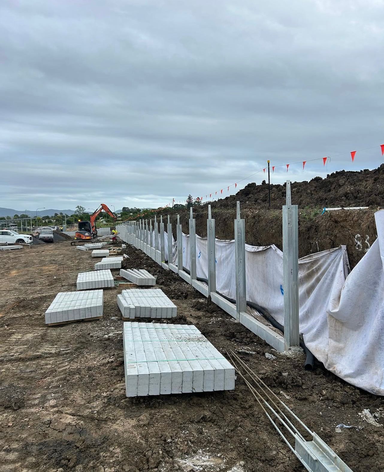 Concrete Fence Posts and Panels Being Installed — Chief Structural Landscaping In Glenvale, QLD