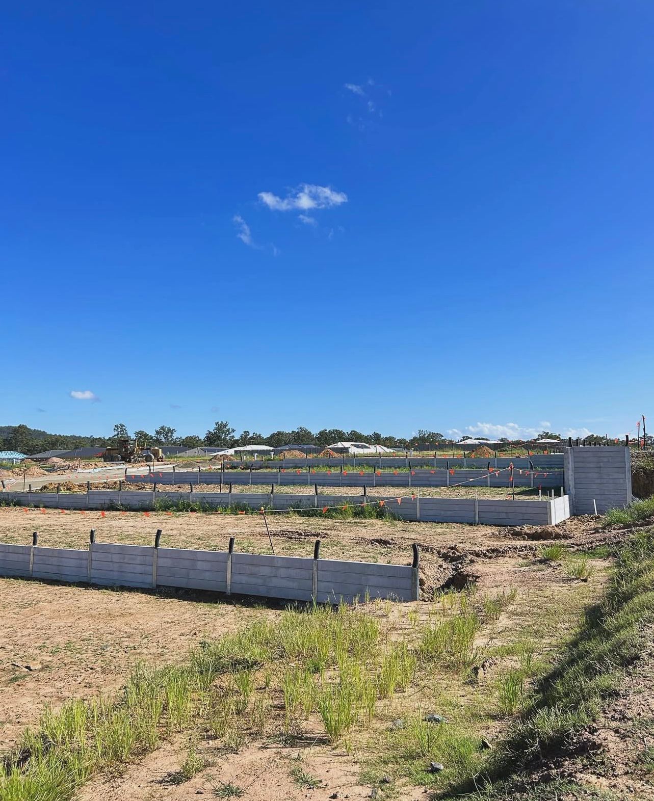 Empty Land With Concrete Fence Sections — Chief Structural Landscaping In Glenvale, QLD