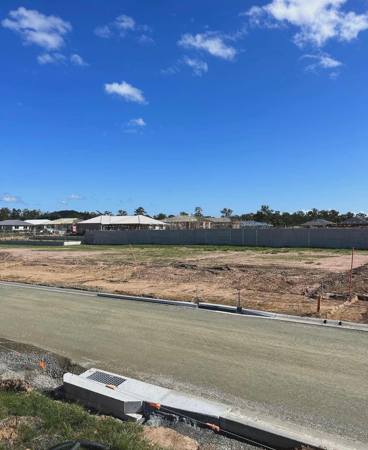 Empty Lots in a New Residential Development With a Blue Sky Background — Chief Structural Landscaping In Glenvale, QLD
