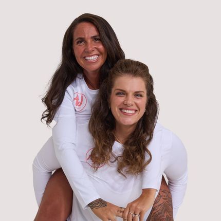 Two women wearing white shirts are posing for a picture  - Average Jenn's - Personalized Workout and Nutrition Plans