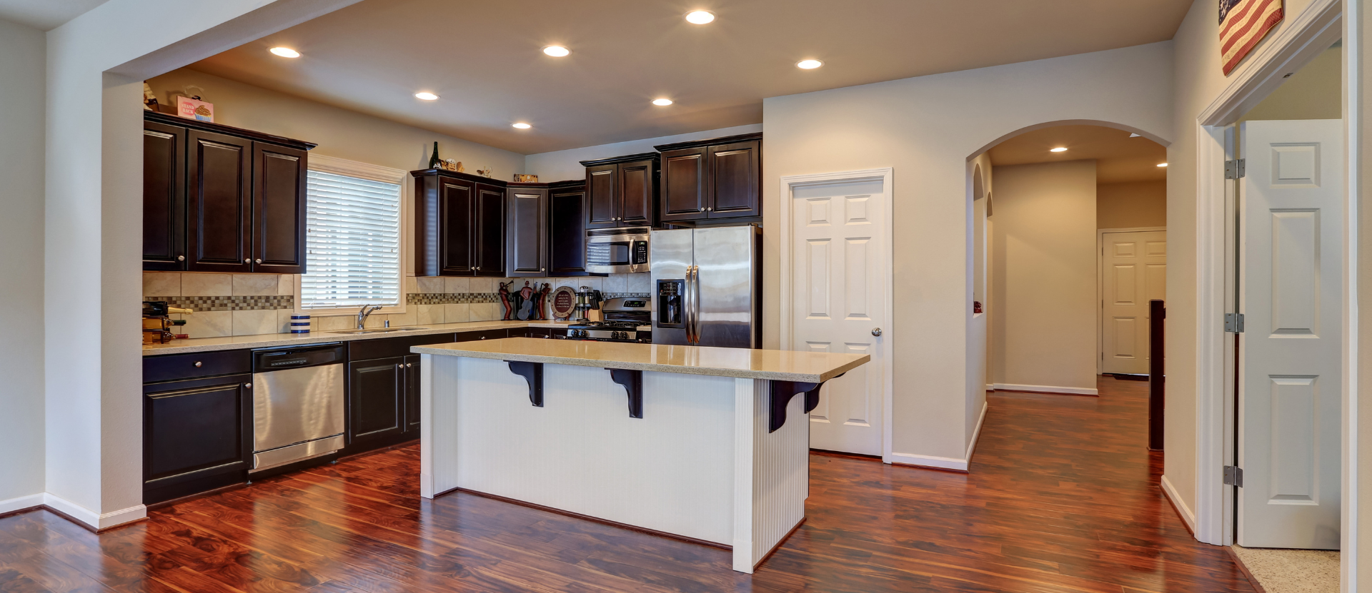 A kitchen with a large island in the middle of the room.