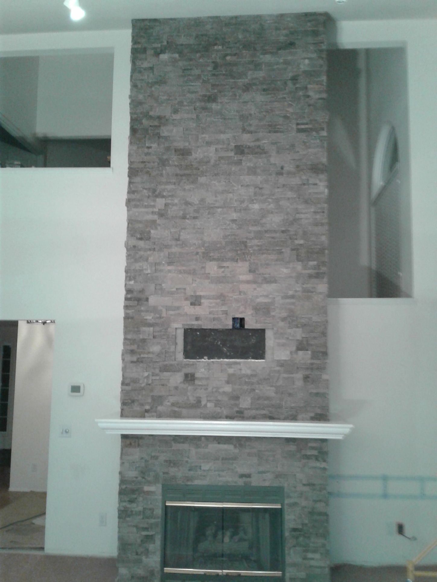There is a fireplace in the middle of the room.