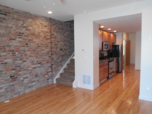 14-24-w-9th-ave- Kitchen with appliances and stair case
