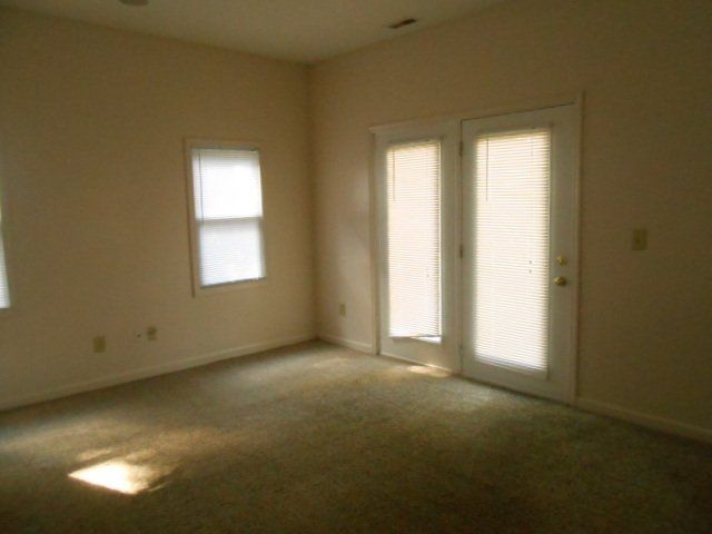 spacious living room with windows