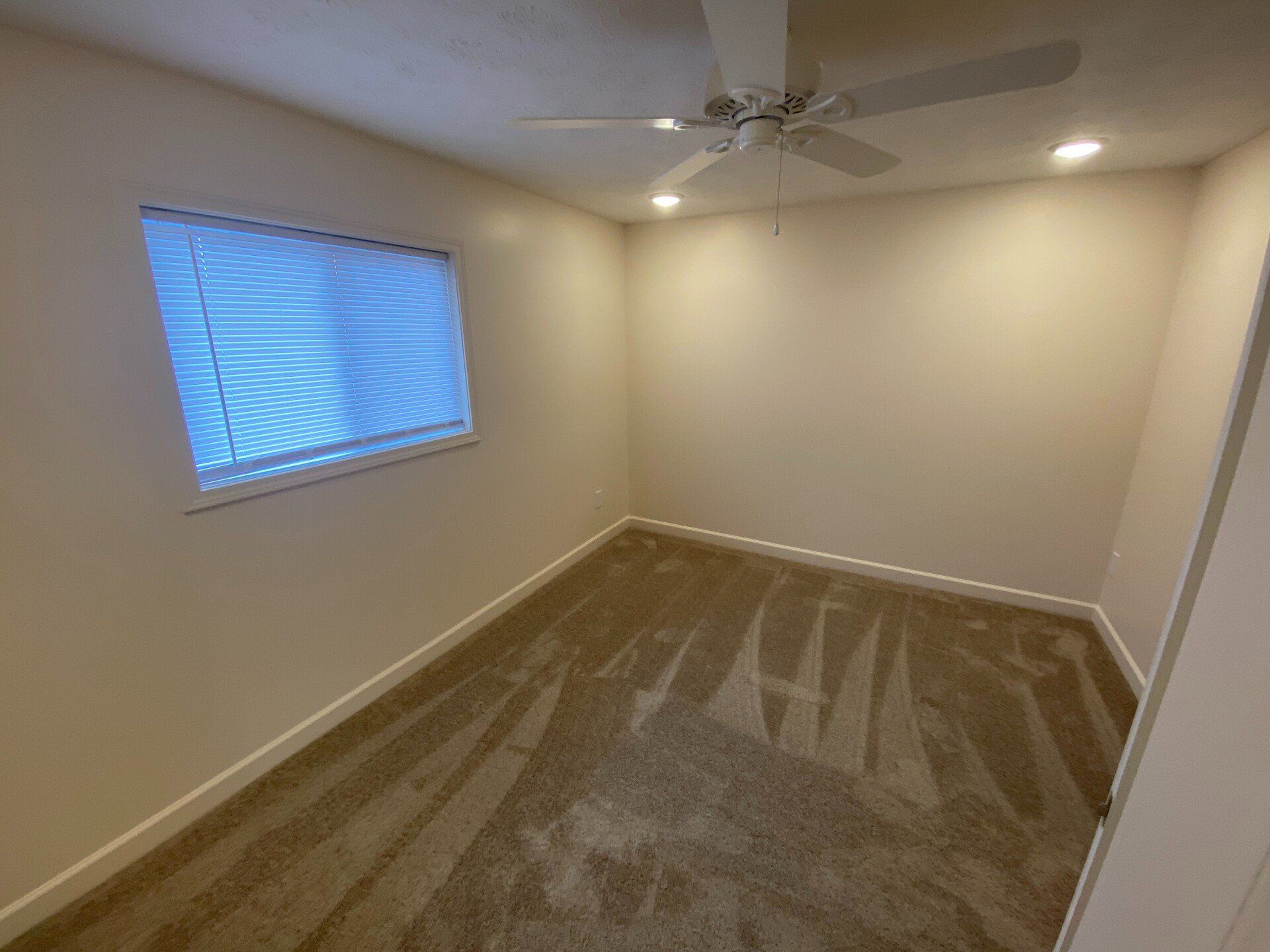 large bedroom with windows