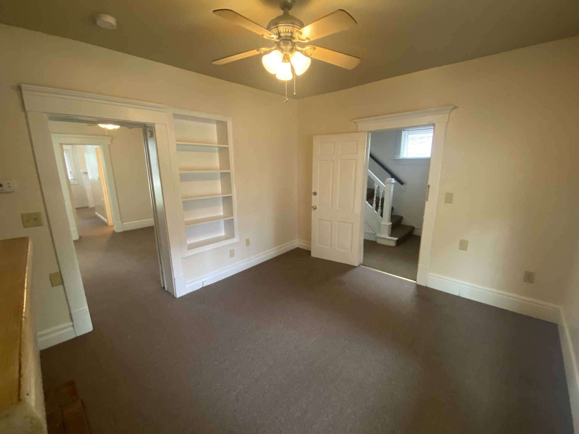 living room with built in bookshelves