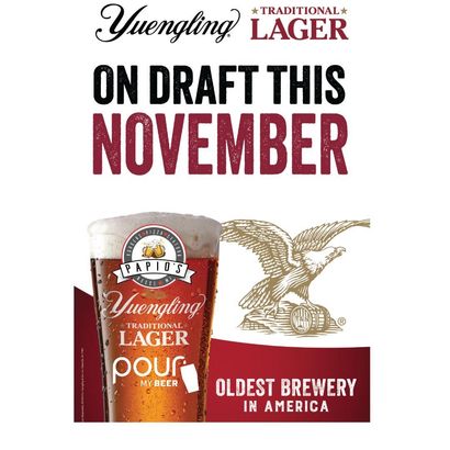 Yuengling Lager on draft in November. Glass of beer with eagle logo, text: 