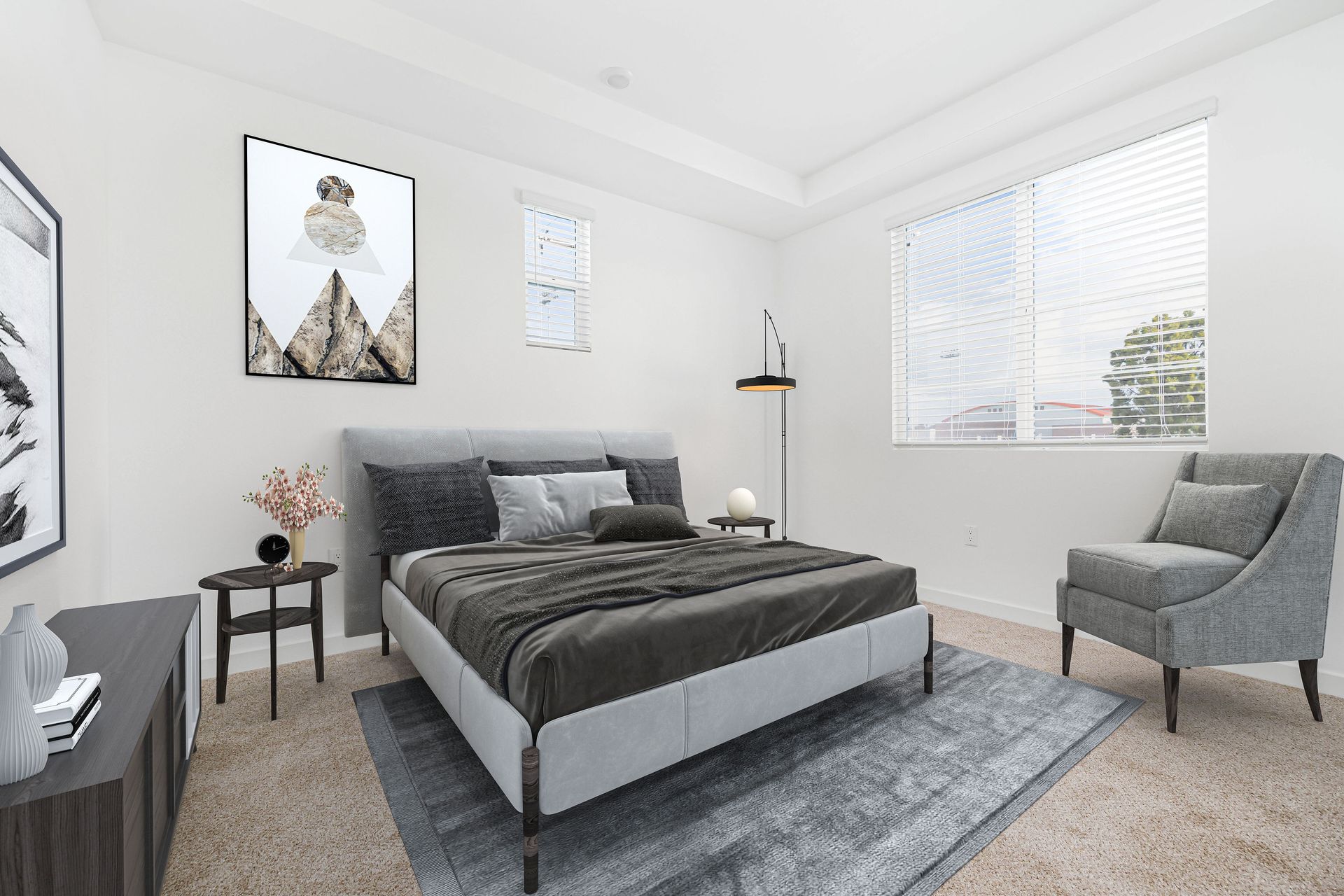 a bedroom with a bed , chair , table and window .