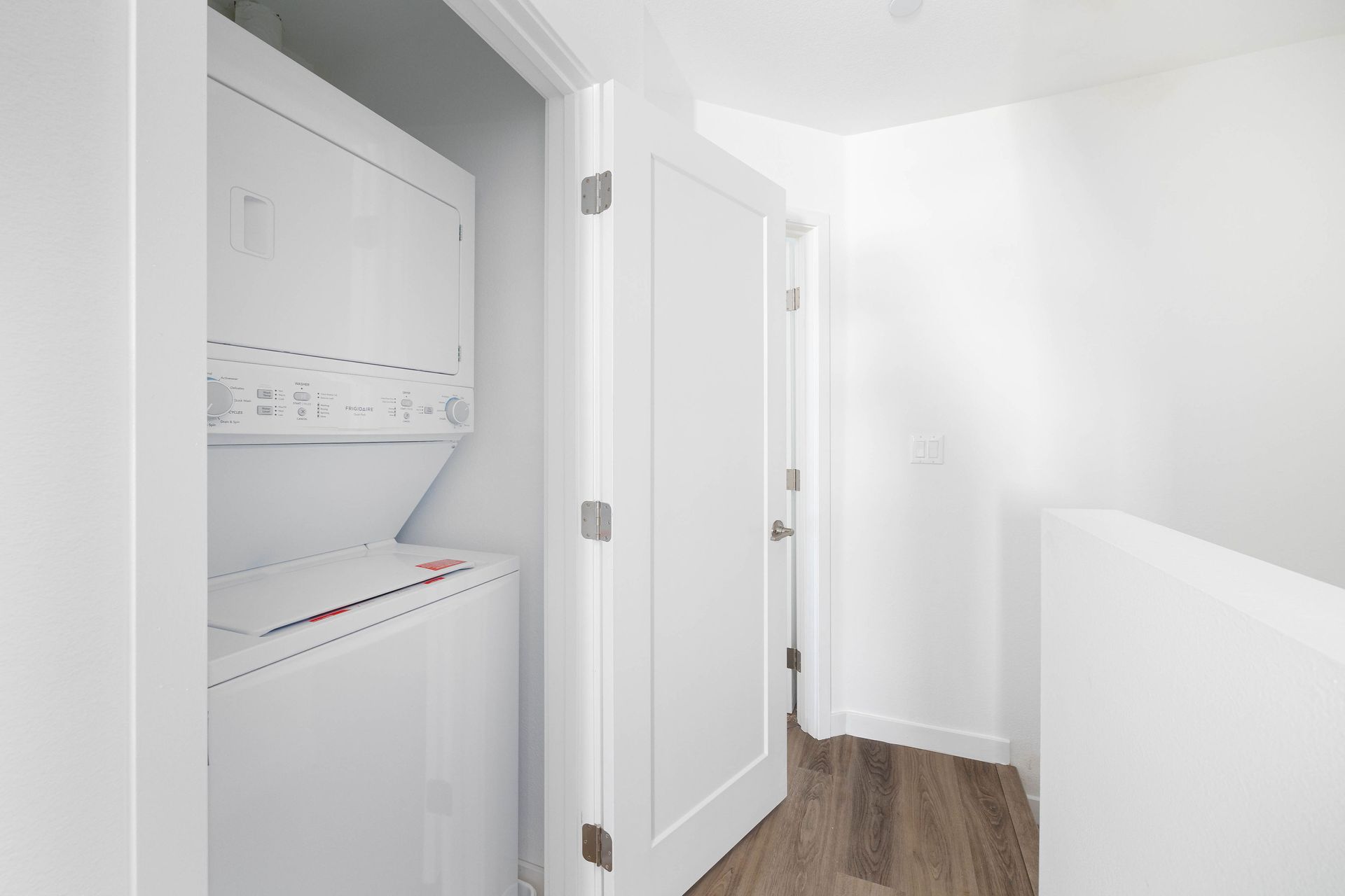 a laundry room with a washer and dryer in a closet .
