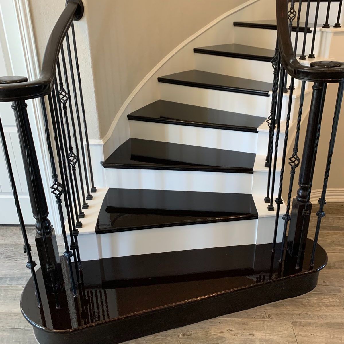 Custom stair installation by Lone Star Custom Woodworks: featuring modern stairs installation, dark wood install, craftsman railings, and balusters.