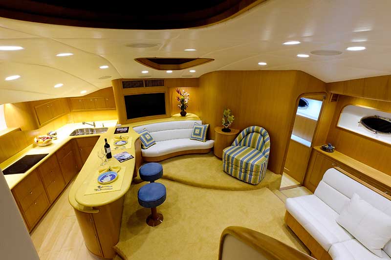 A living room with a couch a chair and a bar