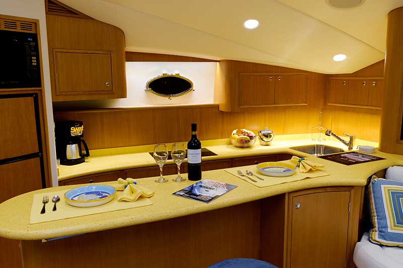 A kitchen with a bottle of wine on the counter