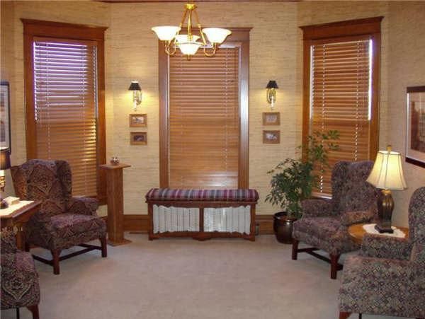 A living room with two chairs and a bench