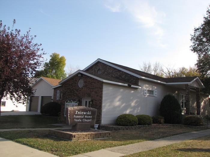 A small house with a sign in front of it that says ' tribeca ' on it
