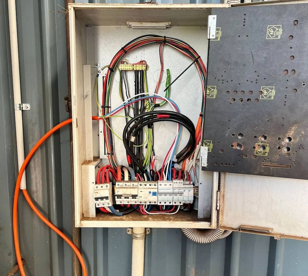 Open Electrical Panel With Exposed Wires and Circuits — Himec Electrical In Withcott, QLD