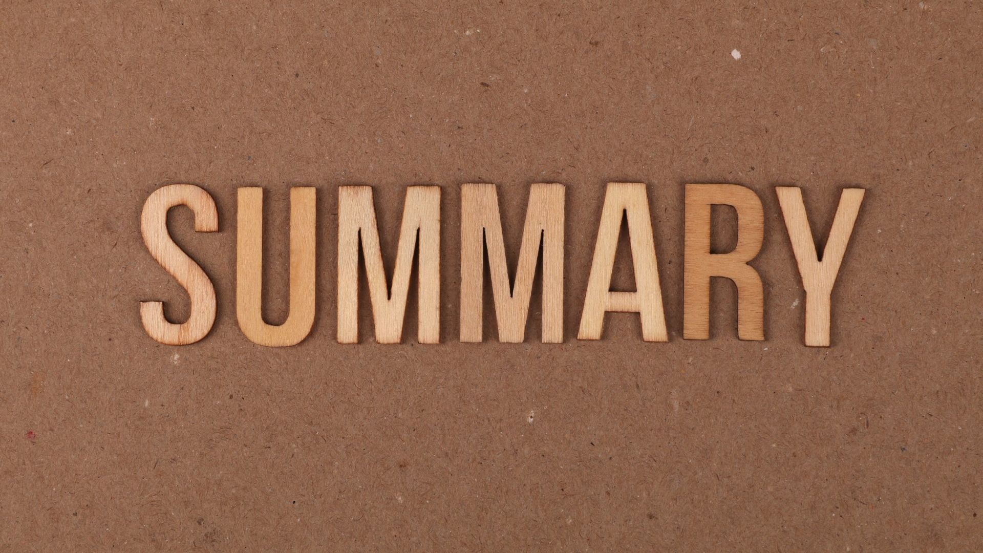 The word summary is written in wooden letters on a brown background.