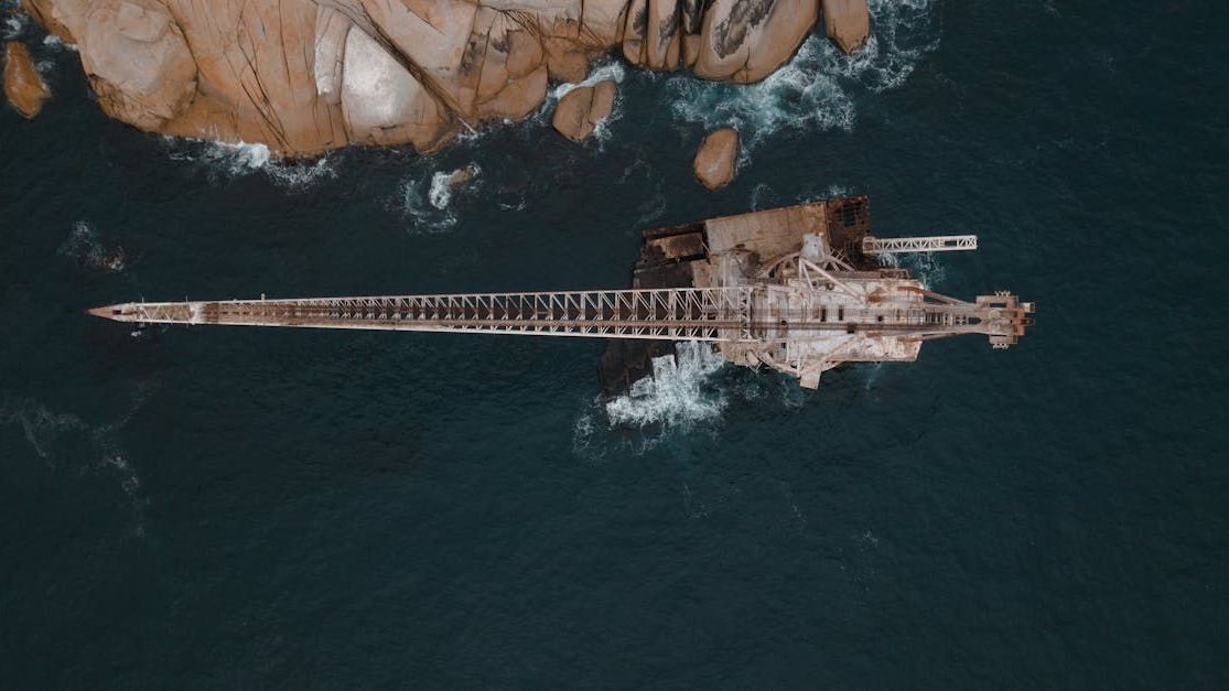 An aerial view of a large ship in the middle of the ocean.