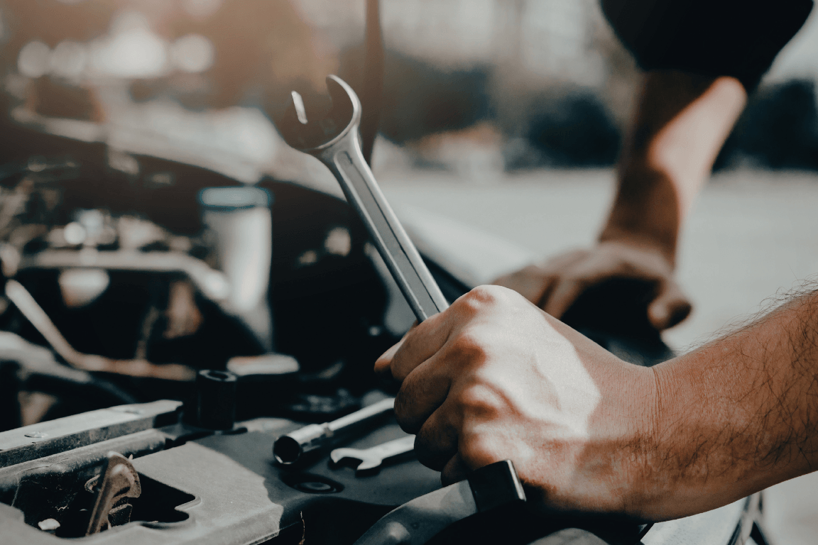 mechanic holding a wrench