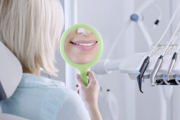 Denture cleaning is done for woman