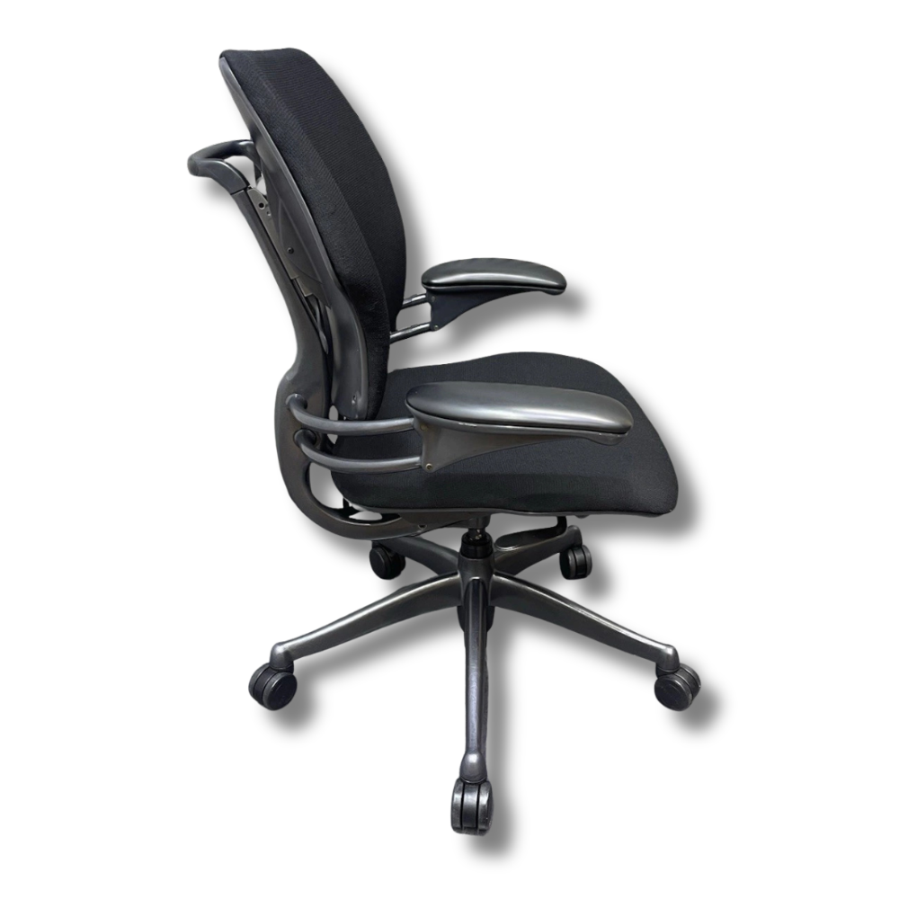 Used Herman Miller Aeron Black ergonomic office chair, side view. Mesh back and seat, armrests, five-star base with wheels.
