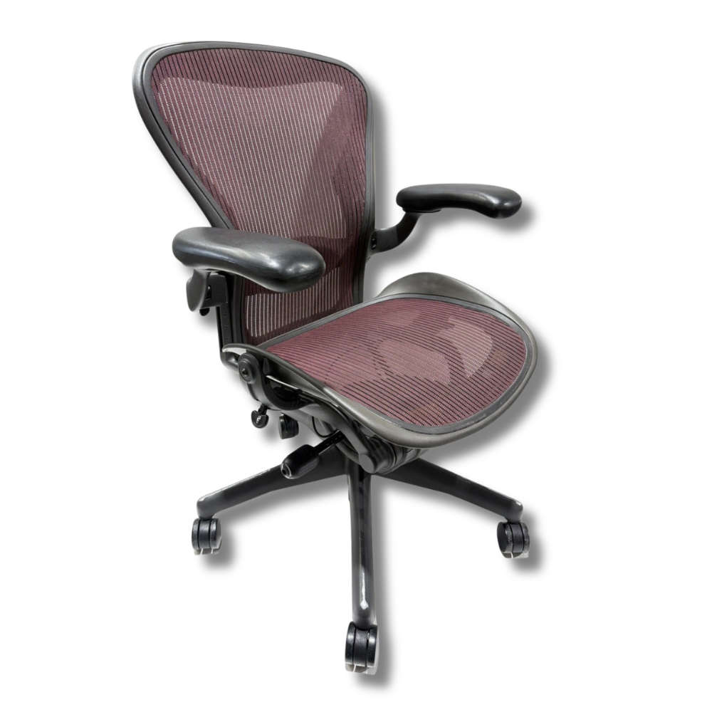 Used Herman Miller Aeron Dark gray Aeron ergonomic office chair with dark mesh seat and back.