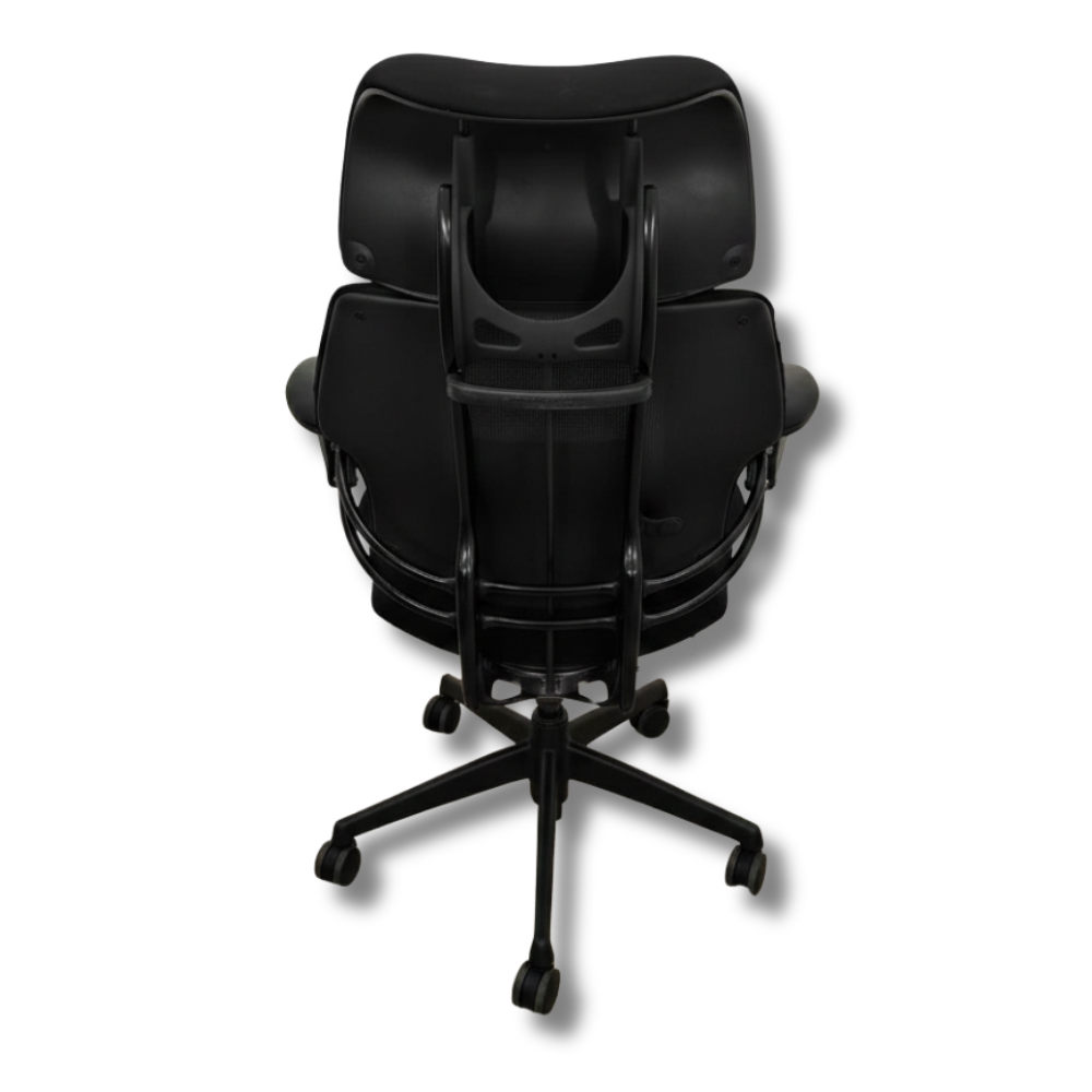 Used Herman Miller Aeron Black ergonomic office chair, back view, with a mesh back and adjustable arms.