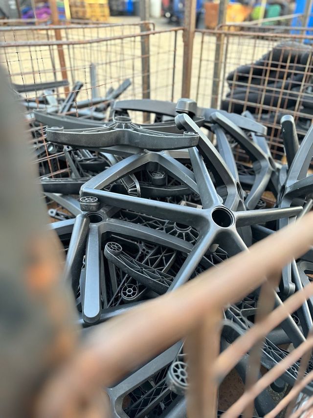 Five-star chair bases sorted into a steel stillage