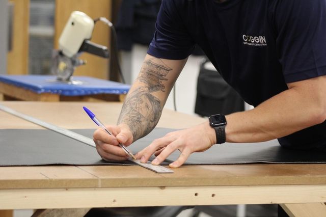 A desk top being marked out for cutting