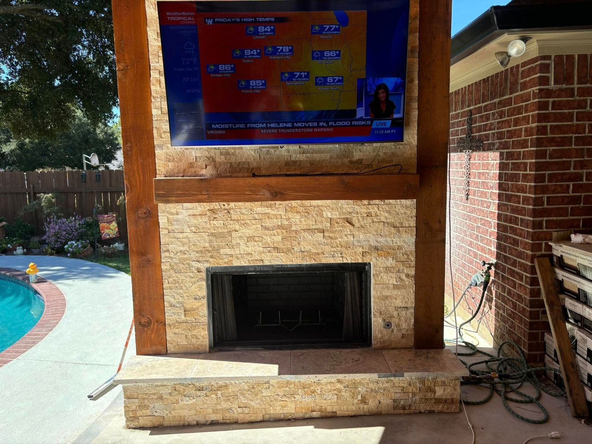 A fireplace with a flat screen tv above it