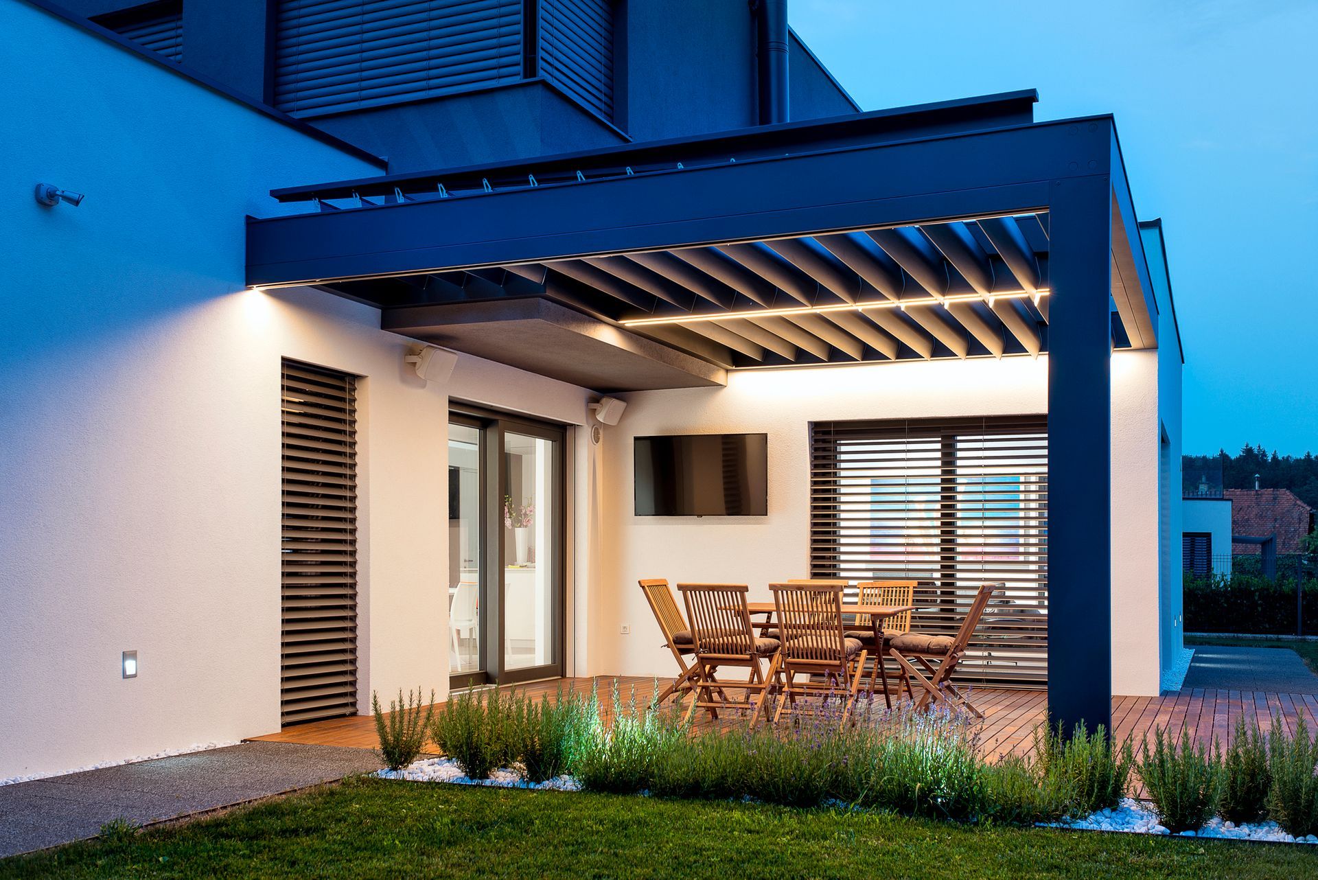 Modern patio setup with wood furniture under a sleek pergola. Modern patio setup with wood furniture under a sleek pergola.