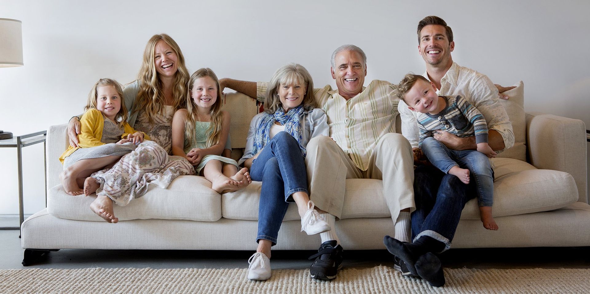 family seated on sofa