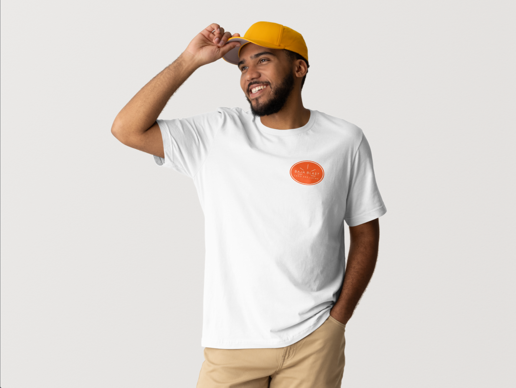 Folded white t-shirts with an orange circular logo, stacked on a white surface.
