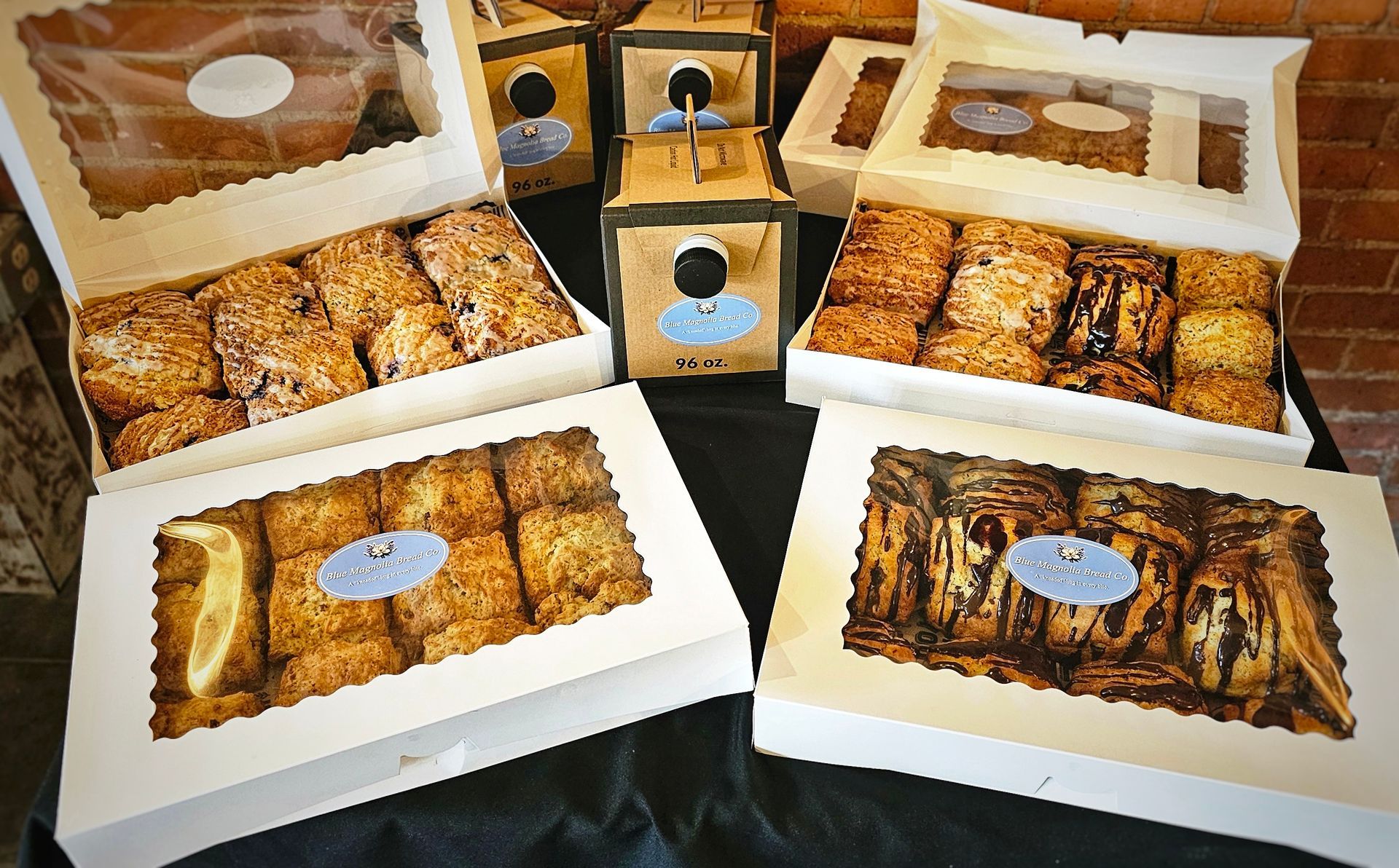 A group of people are standing in a room talking to each other.