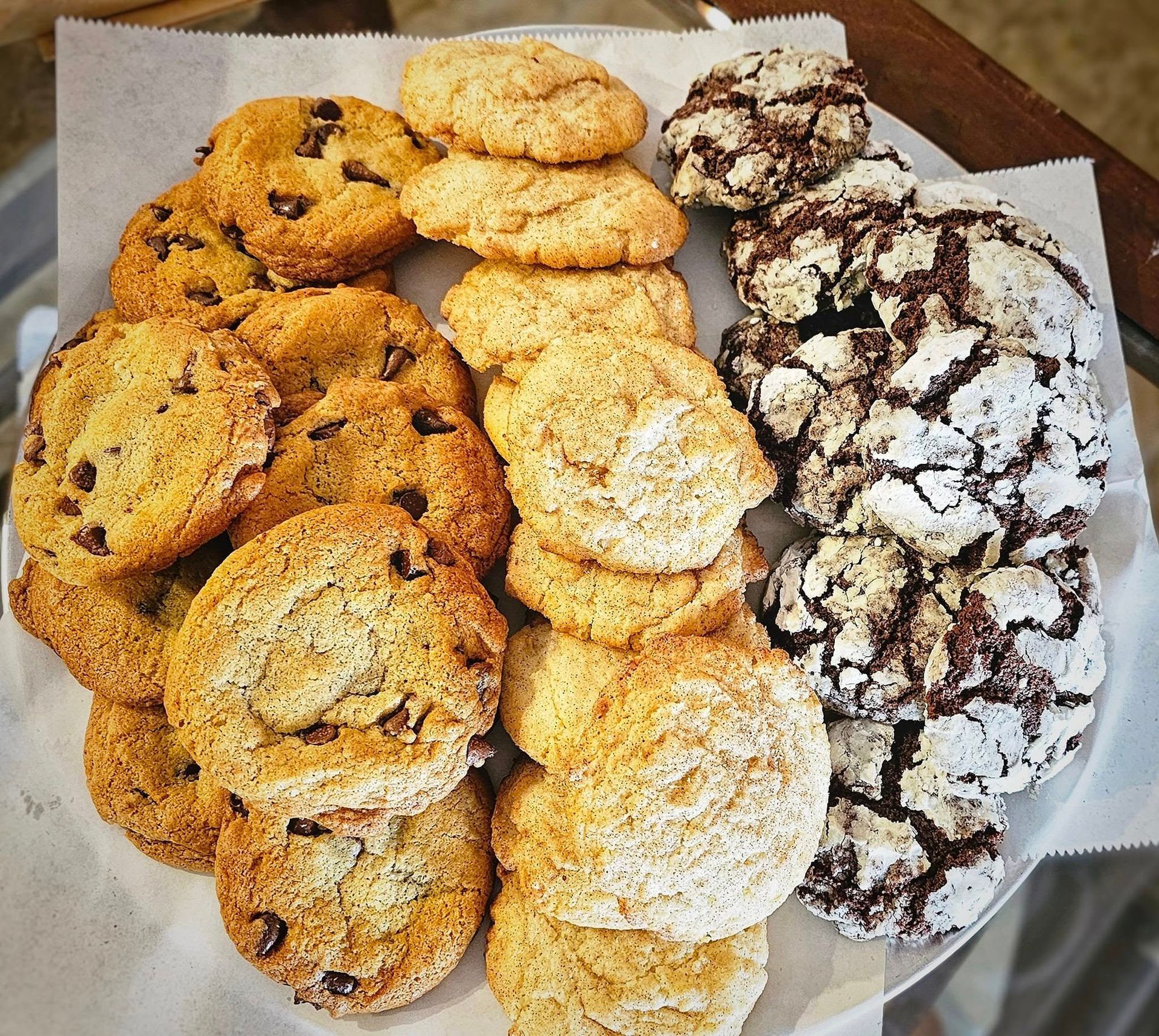 A plate of different types of cookies on a table